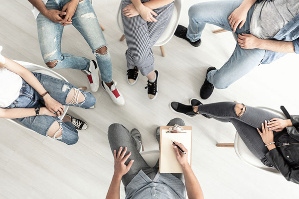 A support group sitting together in conversation
